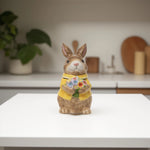 Load image into Gallery viewer, Yellow Bunny Cookie Stasher - Ceramic bunny figurines with flower baskets for Easter decor | Hand-painted ceramic bunny| Whimsical spring decor ceramic bunnies | Bunny Cookie Stasher | Cute cookie Stasher | Home Decor | Kitchen Ware
