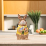 Load image into Gallery viewer, Yellow Bunny Cookie Stasher - Ceramic bunny figurines with flower baskets for Easter decor | Hand-painted ceramic bunny| Whimsical spring decor ceramic bunnies | Bunny Cookie Stasher | Cute cookie Stasher | Home Decor | Kitchen Ware
