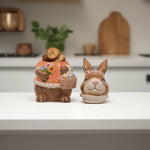 Load image into Gallery viewer, Orange Bunny Cookie Stasher - Ceramic bunny figurines with flower baskets for Easter decor | Hand-painted ceramic bunny| Whimsical spring decor ceramic bunnies | Bunny Cookie Stasher | Cute cookie Stasher | Home Decor | Kitchen Ware
