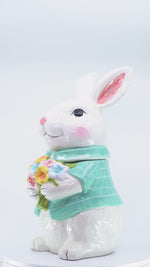 Load and play video in Gallery viewer, Blue Bunny Cookie Stasher   Ceramic bunny figurines with flower baskets for Easter decor | Hand-painted ceramic bunny| Whimsical spring decor ceramic bunnies | Bunny Cookie Stasher | Cute cookie Stasher | Home Decor | Kitchen Ware
